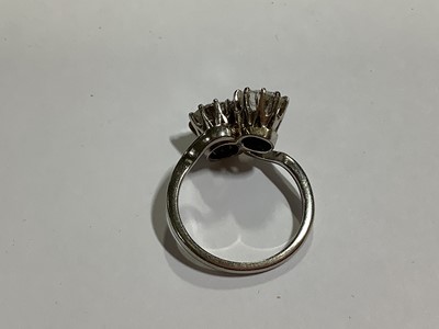 Lot 11 - A diamond two stone crossover ring.