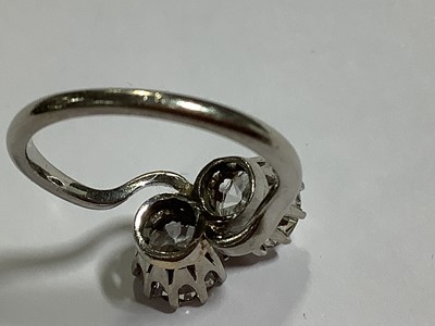 Lot 11 - A diamond two stone crossover ring.