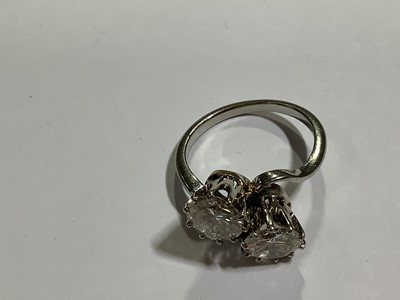 Lot 11 - A diamond two stone crossover ring.