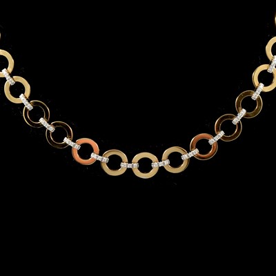 Lot 192 - A modern 18 carat yellow and white gold diamond set necklace.