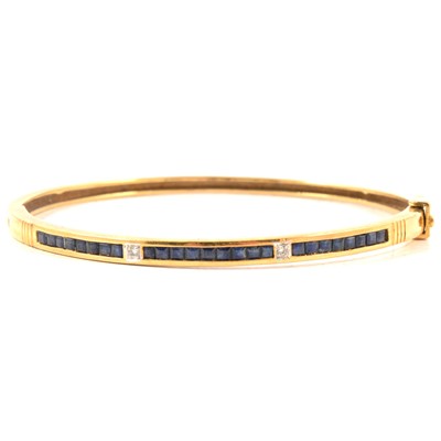 Lot 157 - A sapphire and diamond half hinged bangle.