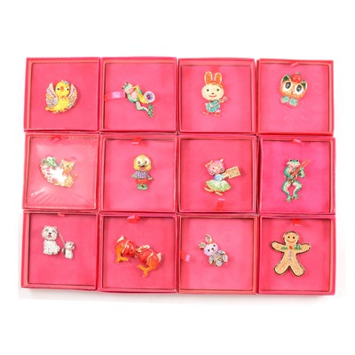 Lot 353 - Butler & Wilson - twelve novelty crystal brooches, pink boxed Circa  2011-2015.