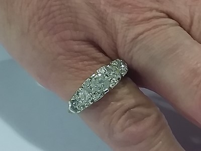 Lot 18 - A diamond five stone reproduction Victorian clarved claw ring.