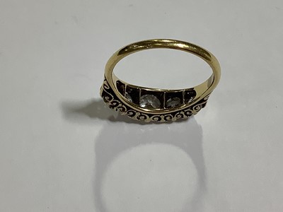 Lot 17 - A diamond five stone half hoop ring.