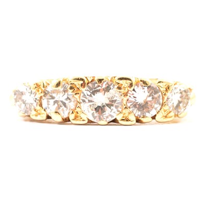 Lot 19 - A diamond five stone ring.