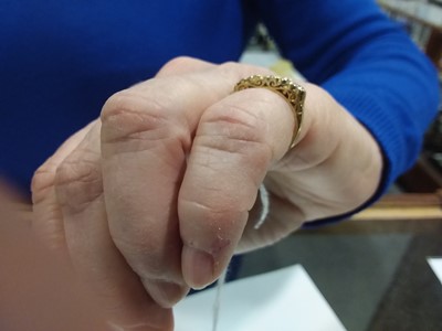 Lot 19 - A diamond five stone ring.