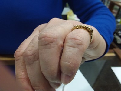 Lot 19 - A diamond five stone ring.