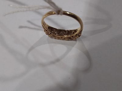 Lot 19 - A diamond five stone ring.