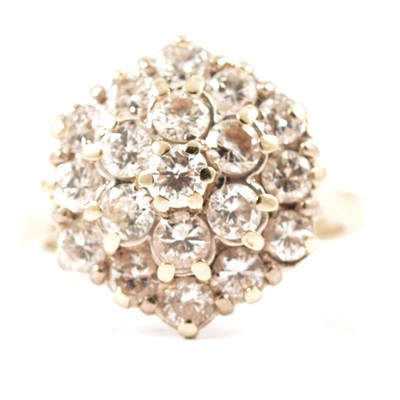 Lot 34 - A hexagonal diamond cluster ring.