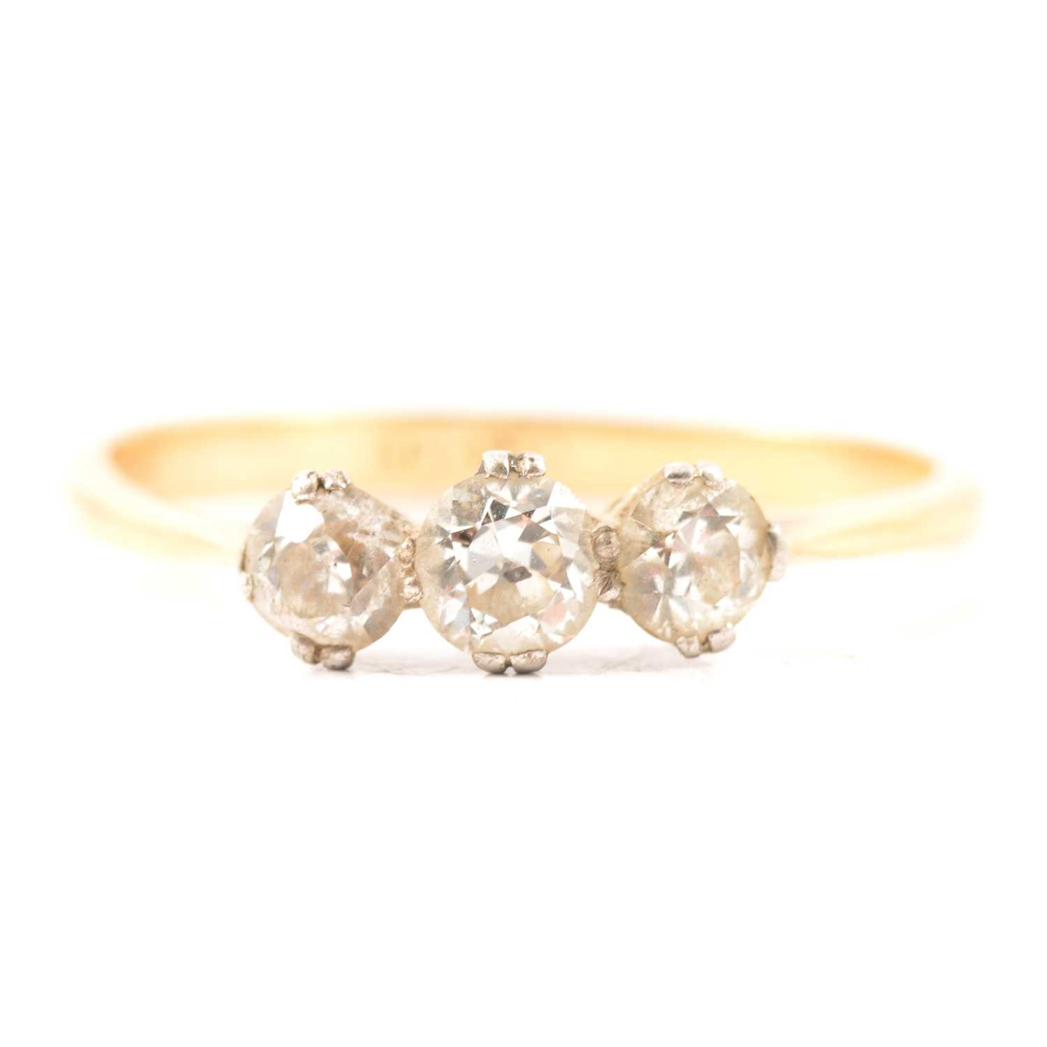 Lot 15 - A diamond three stone ring.
