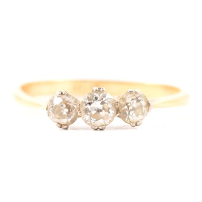 Lot 15 - A diamond three stone ring.