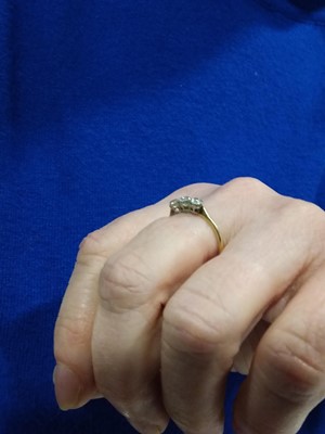 Lot 15 - A diamond three stone ring.