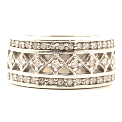 Lot 35 - A wide diamond set ring.