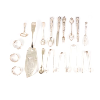 Lot 236 - A silver three piece christening set, three napkin rings, sugar tongs, small flatware.