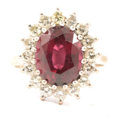Lot 61 - A garnet and diamond cluster ring.
