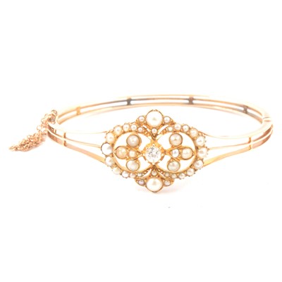 Lot 158A - An Edwardian diamond and pearl bangle.