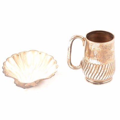 Lot 223 - Silver scallop-shape butter dish, Walker & Hall, Sheffield 1913, and a silver Christening mug.