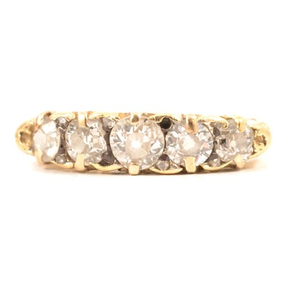 Lot 33 - A diamond five stone half hoop ring.