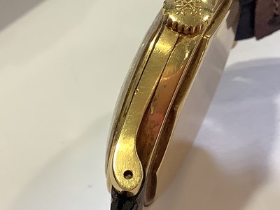 Lot 309 - Patek Philippe - a gentleman's yellow metal wristwatch.
