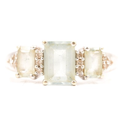 Lot 94 - An aquamarine and diamond ring.
