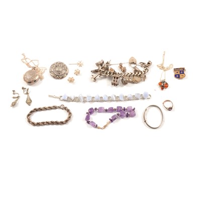 Lot 392 - A collection of silver jewellery, charms bracelet, locket, pendants, stone bracelets.