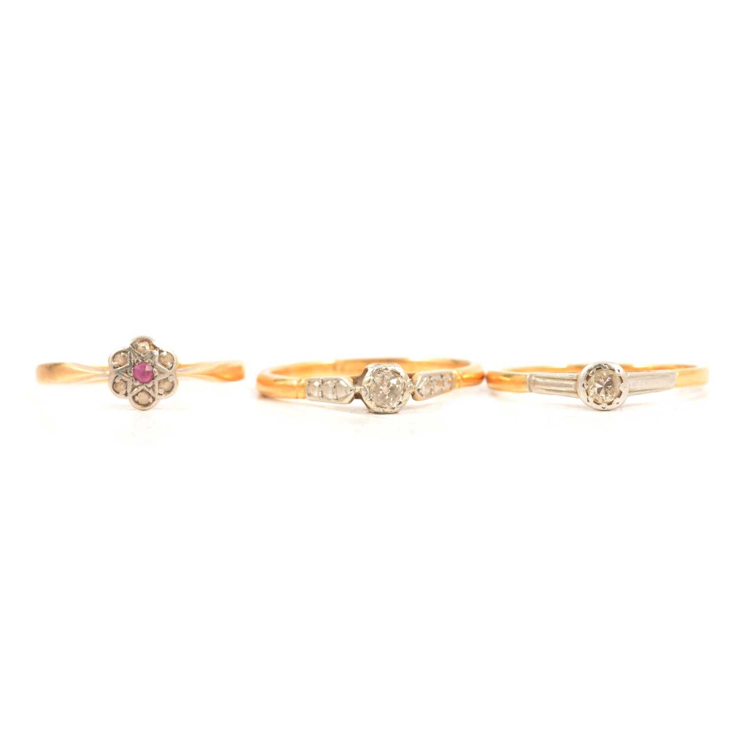 Lot 13 - Two diamond solitaire rings and a small cluster ring.
