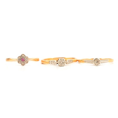 Lot 13 - Two diamond solitaire rings and a small cluster ring.