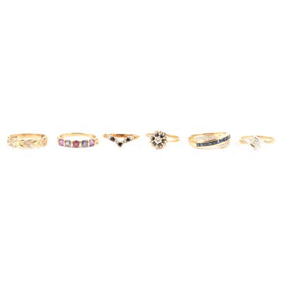 Lot 104 - Six gold gemset dress rings.
