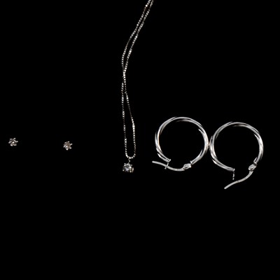 Lot 290 - A diamond solitaire pendant and chain, pair of stud earrings, pair of hoop earrings.