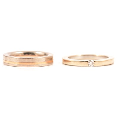 Lot 41 - A wedding band and a similar ring set with a diamond.