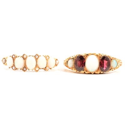 Lot 83 - Two opal half hoop rings.