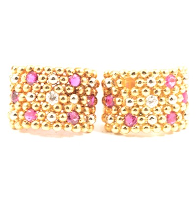 Lot 74 - A contemporary ruby and diamond ring and similar single earring.