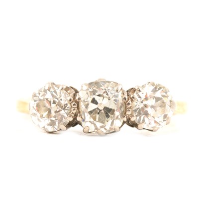 Lot 18 - A diamond three stone ring.