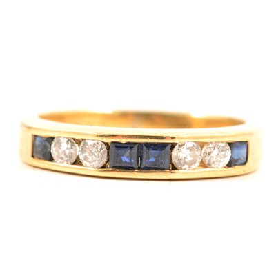 Lot 58 - Two eternity rings, emerald, sapphire and diamond.
