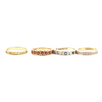 Lot 43 - Four gemset half eternity rings.
