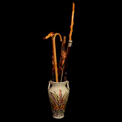Lot 478 - A collection of walking sticks and umbrellas.