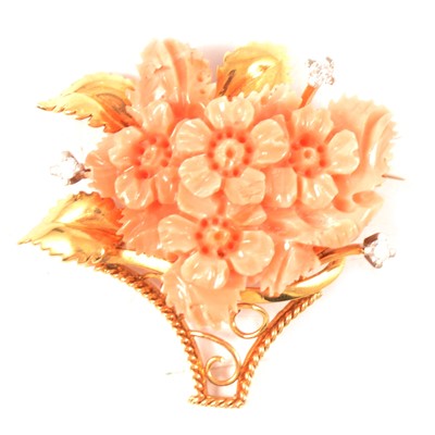 Lot 322 - A coral and diamond gold brooch.