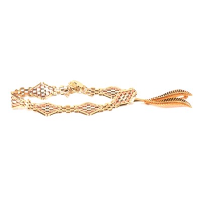 Lot 338 - A 9 carat multi-colour gold bracelet and fern leaf brooch.