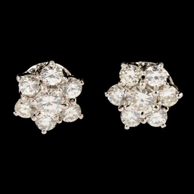 Lot 289 - A pair of diamond cluster earrings.