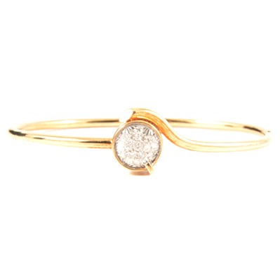 Lot 329 - A diamond set half-hinged bangle.