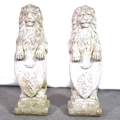 Lot 573 - Pair of reconstituted stone lions