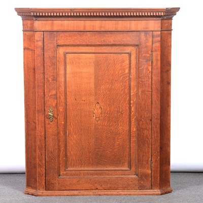 Lot 474 - Georgian oak and mahogany corner cupboard