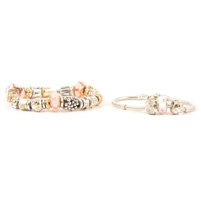 Lot 336 - Pandora - a silver bracelet with silver, gold and Murano glass charms, another smaller bracelet.