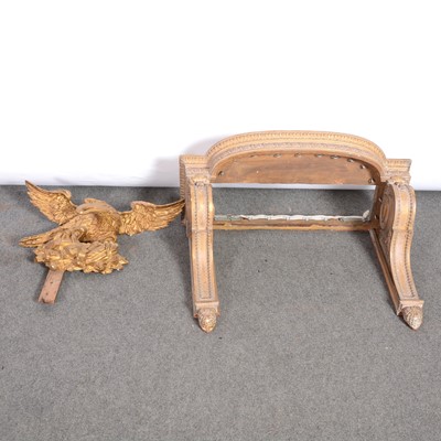 Lot 516 - Carved gilt wood bed canopy bracket, and a large carved gilt eagle surmount