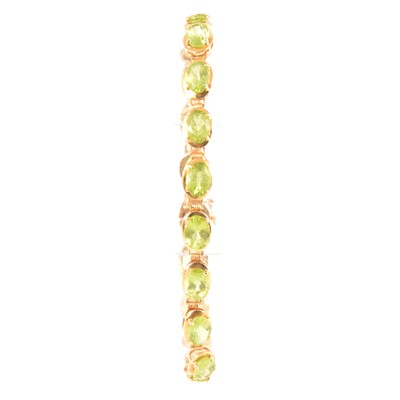 Lot 297 - A peridot bracelet.