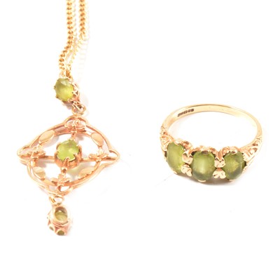 Lot 298 - A peridot ring and pendant and chain.