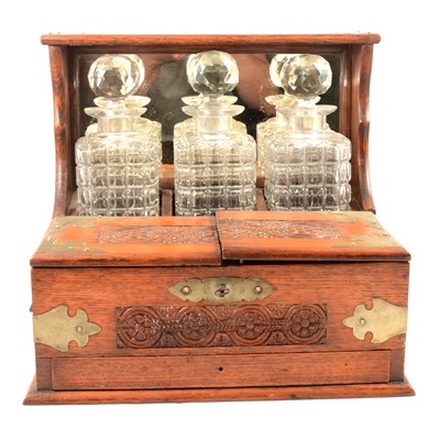 Lot 111 - Victorian oak three-bottle tantalus