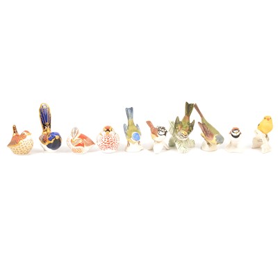 Lot 87 - Four Royal Crown Derby bird paperweights, and 20 Goebel bird figurines.