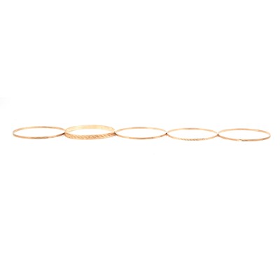 Lot 224 - Five 9 carat yellow gold bangles.