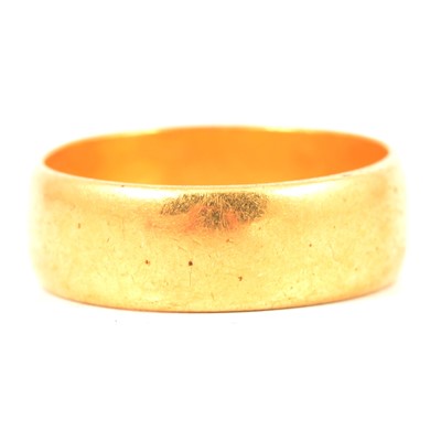 Lot 217 - A 22 carat yellow gold wedding band.